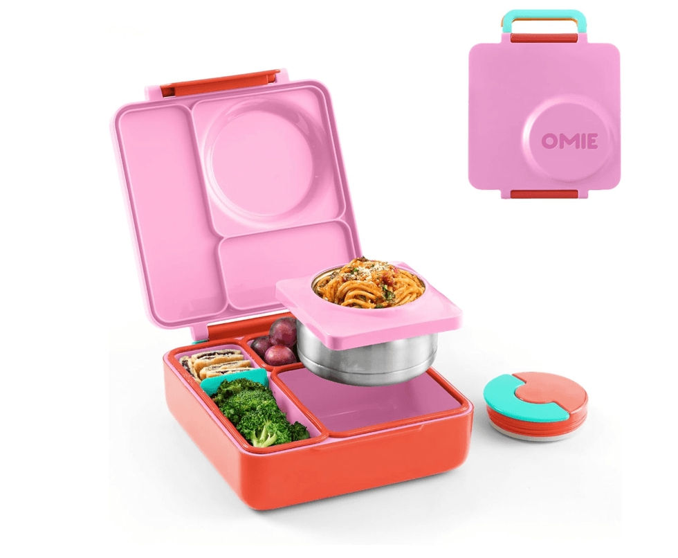 Colorful bento box with spaghetti, broccoli, and radishes; pink lid marked "OMIE."