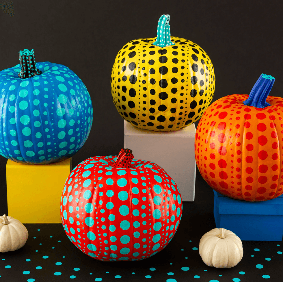 Colorful dotted pumpkins on blocks; blue, yellow, orange, and red with polka dots.
