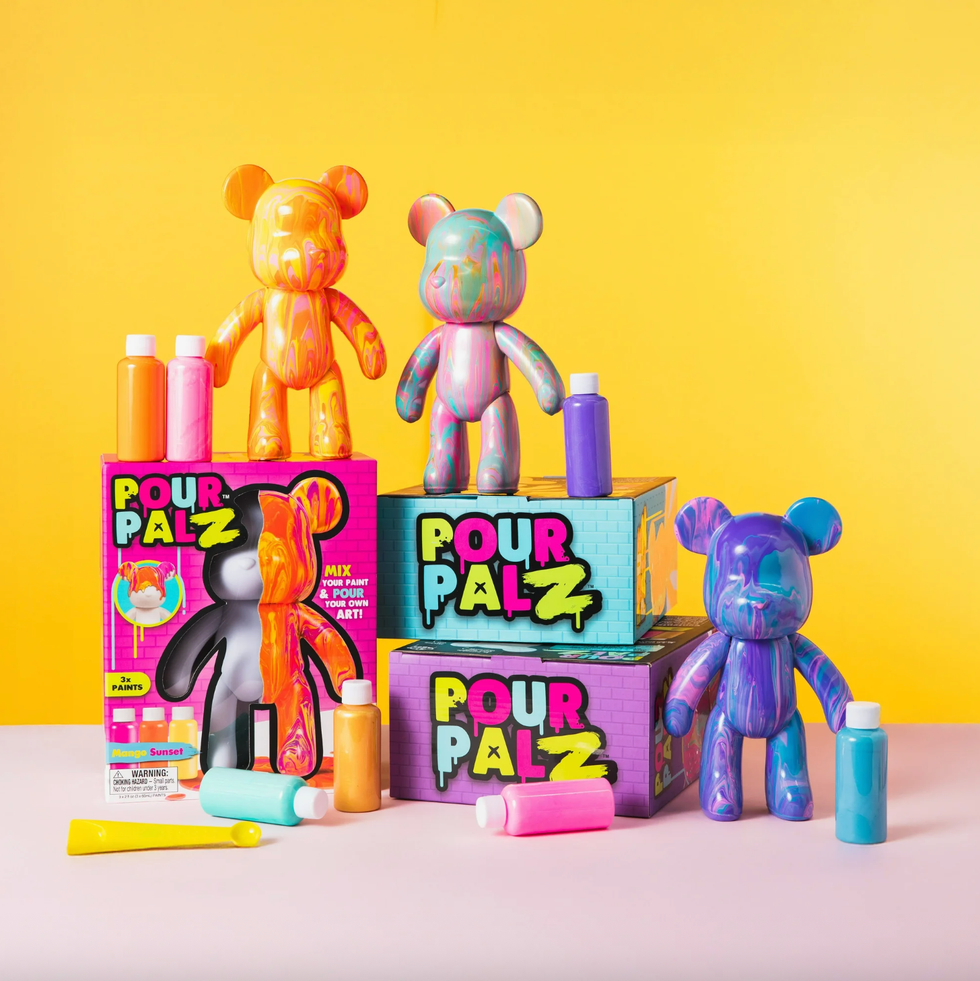 Colorful paint kits and bear figures against a bright yellow background.