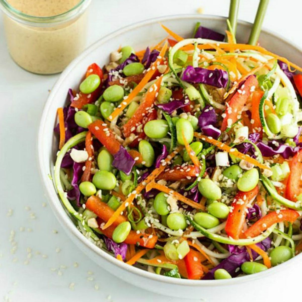 Colorful rainbow bowl of raw vegan recipes