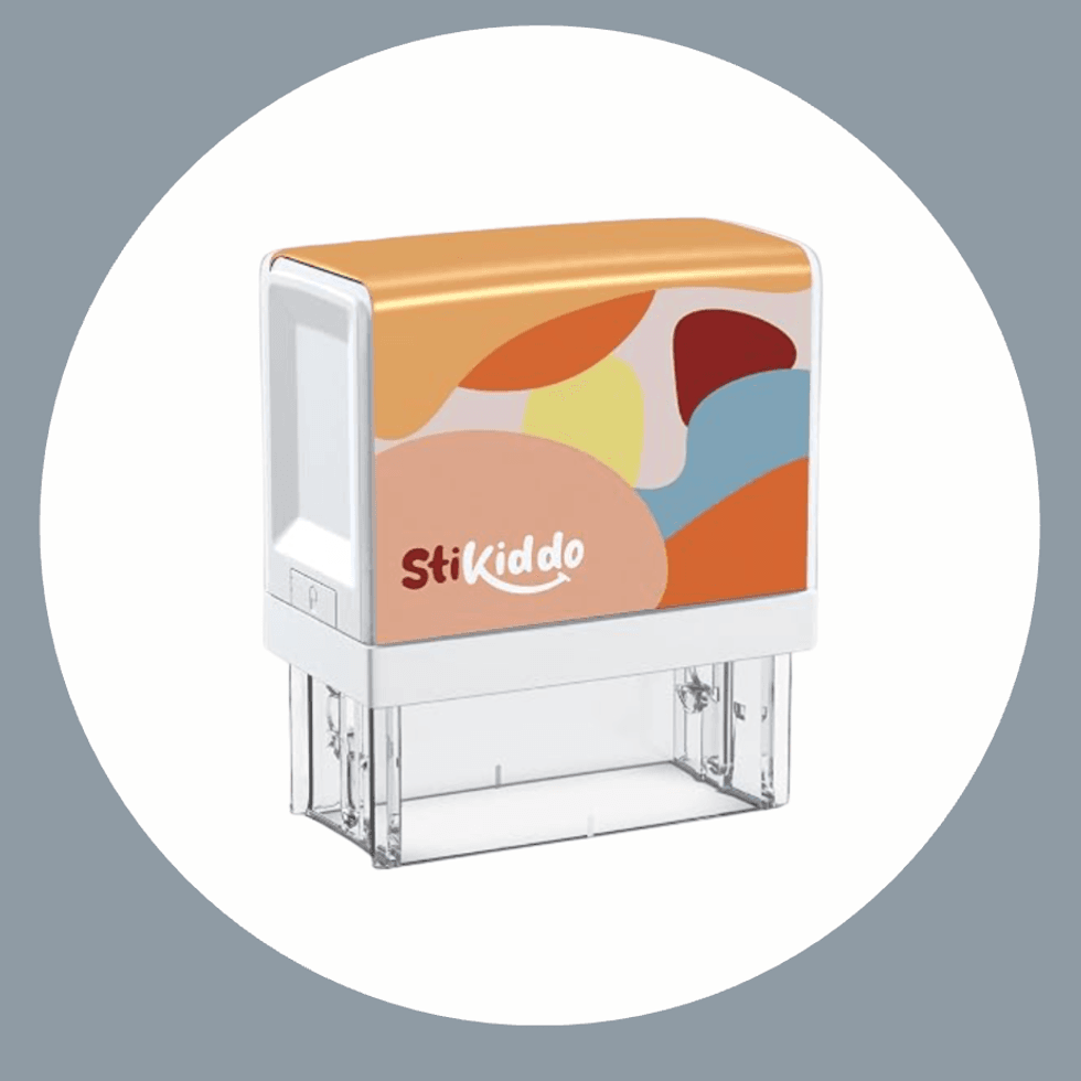 Colorful StiKiddo stamp with abstract shapes on a grey background.