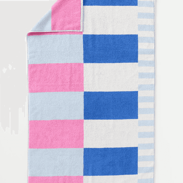 Colorful towel with blue, pink, white squares and stripes.
