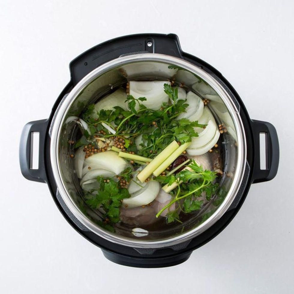 cooking pho ingredients in a pressure cooker