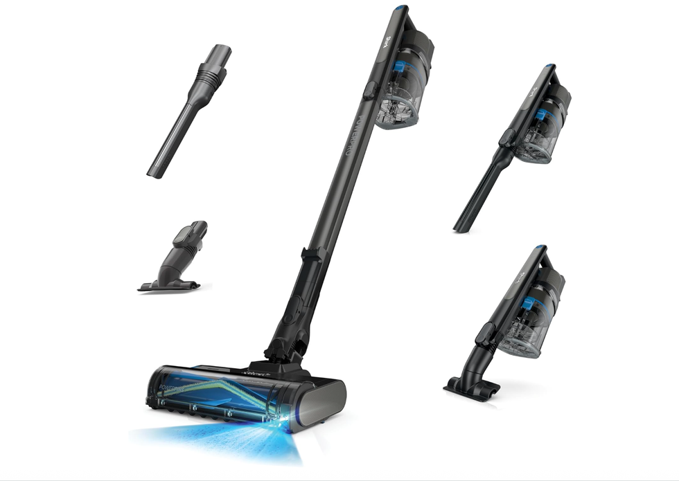 Cordless vacuum cleaner with multiple attachments on a white background.
