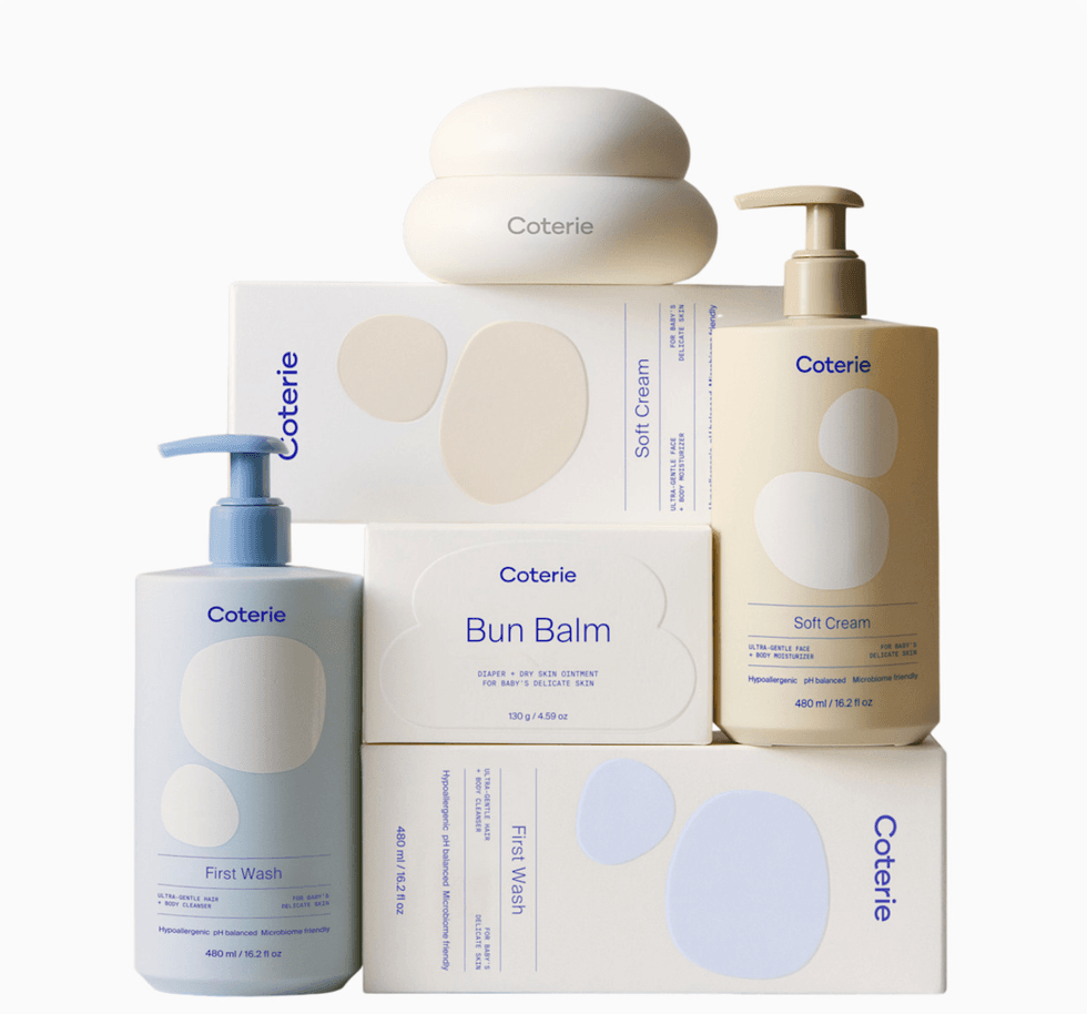 Coterie skincare products: First Wash, Bun Balm, Soft Cream in bottles and boxes.