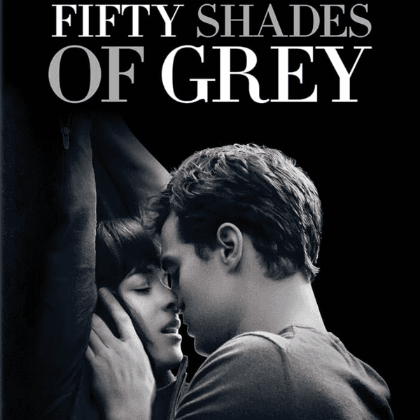 Couple embracing intimately beneath the "Fifty Shades of Grey" title.
