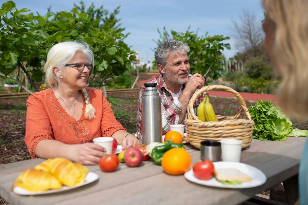 couple enjoying lunch outdoors birthday trip ideas