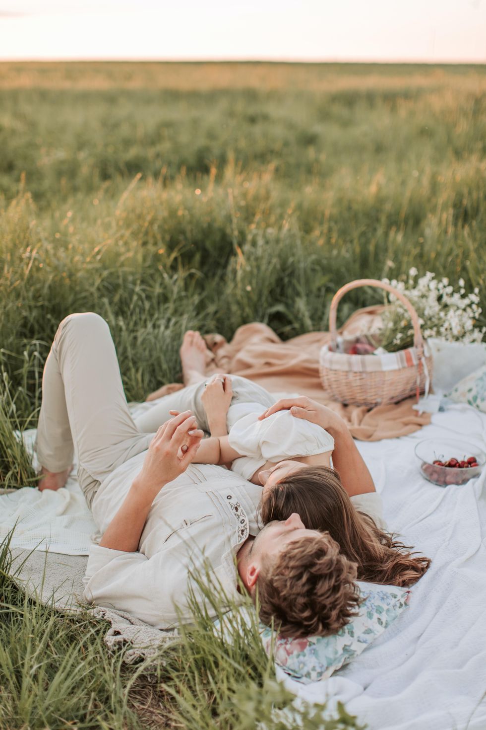 couple having a sunset picnic date night ideas