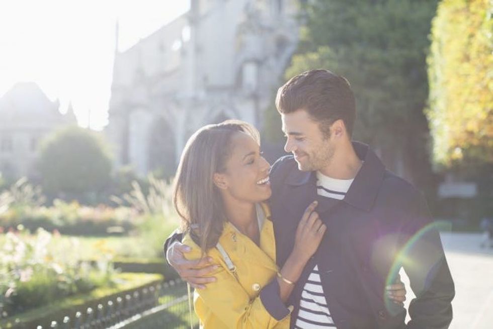 Couple hugging in urban park