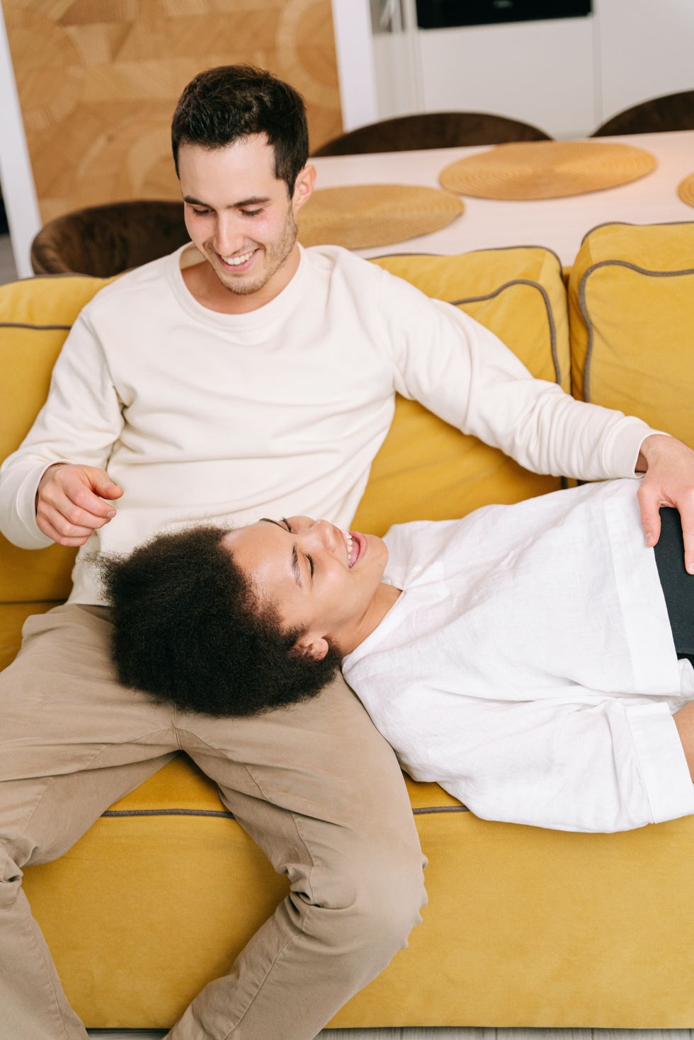 couple on yellow couch