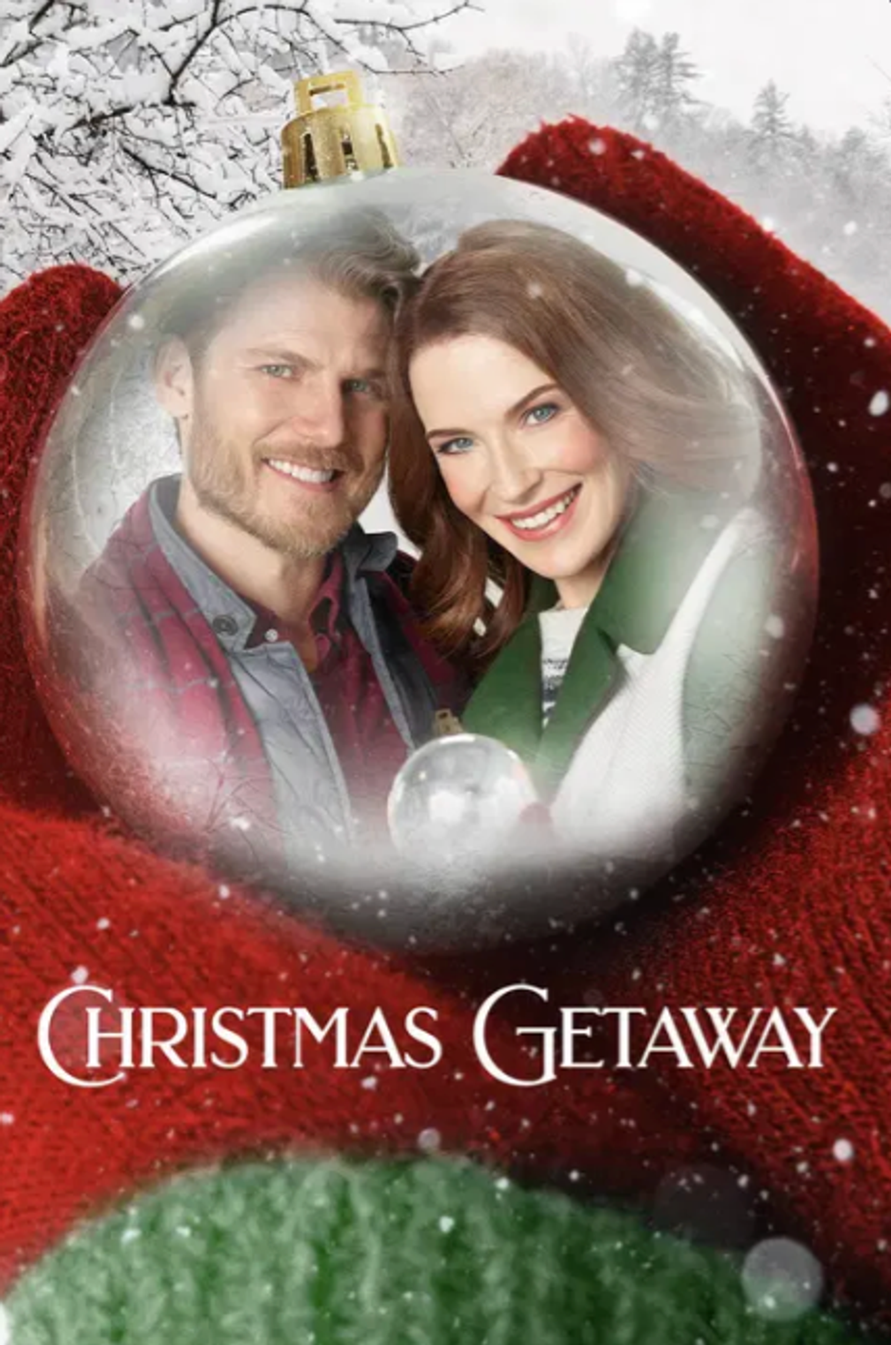 Couple smiling inside a Christmas ornament with snow-covered trees; text reads "Christmas Getaway."