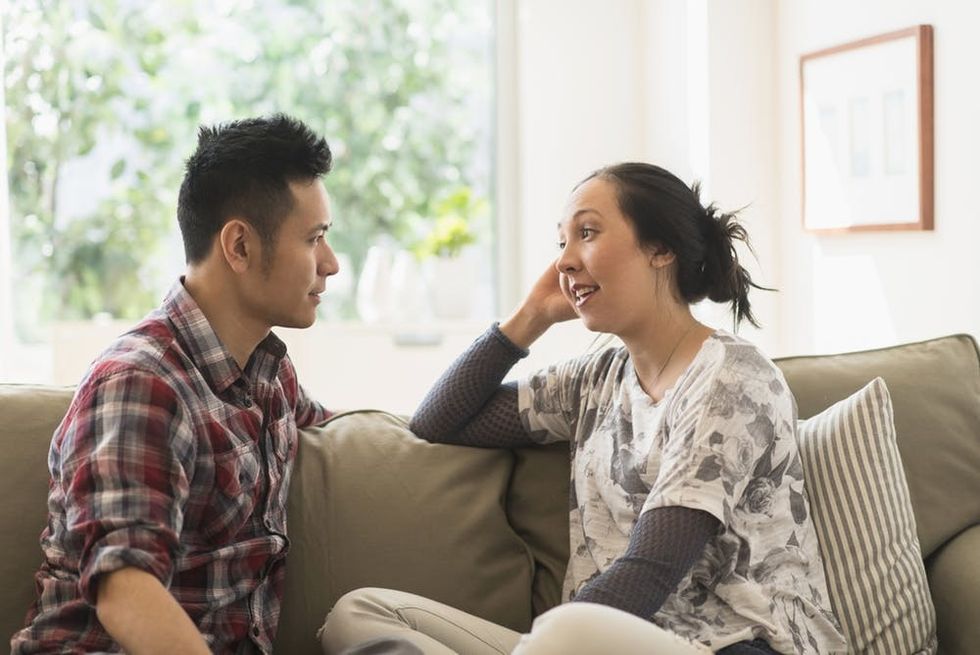 Couple talking on the couch