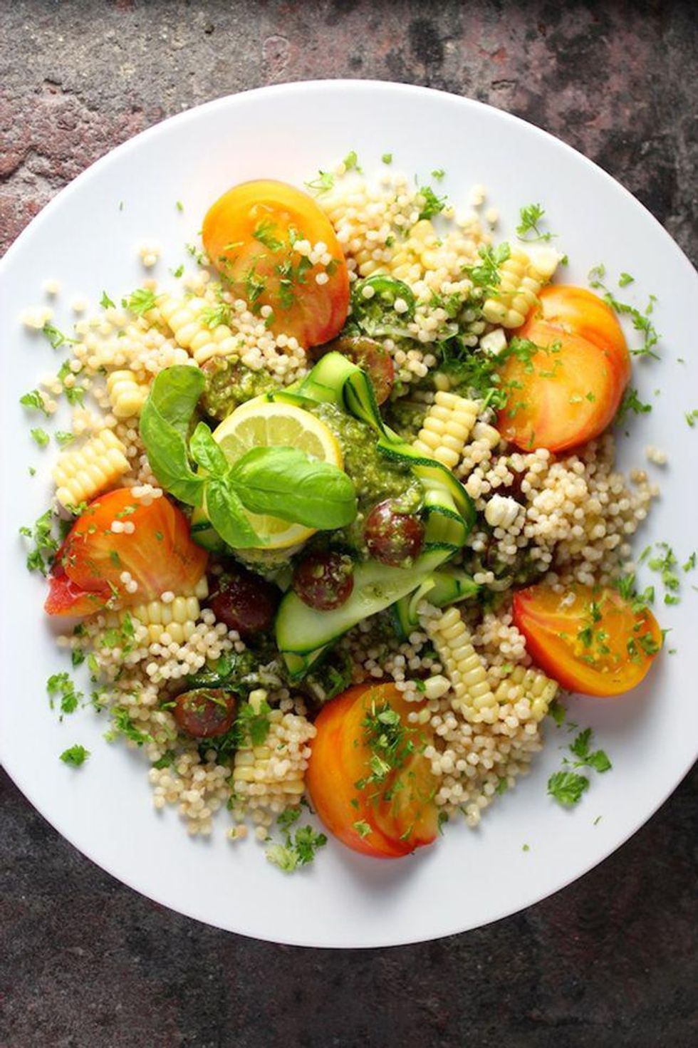 Couscous, Corn and Heirloom Tomato Salad on a white plate