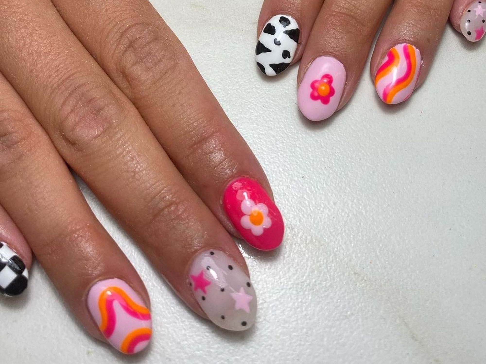 cow print and abstract pink nail designs