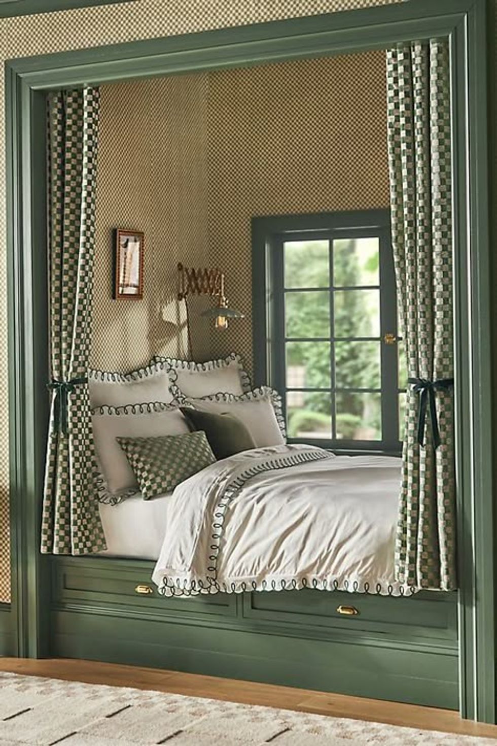 Cozy bed nook with checkered curtains, white bedding, and a window view.