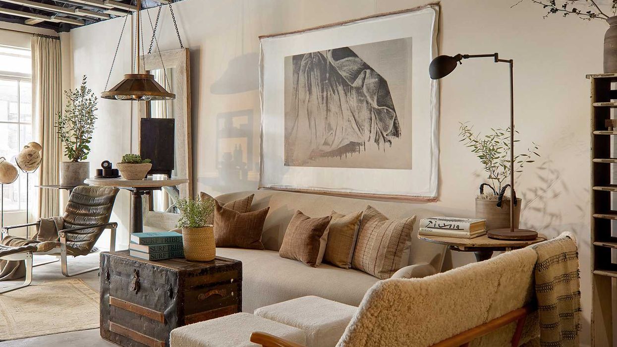 Cozy living room with neutral tones, vintage decor, and rustic accents.