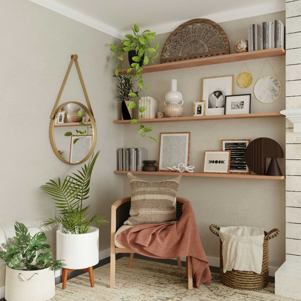 Cozy reading nook with plants, mirror, chair, and decorative shelves.