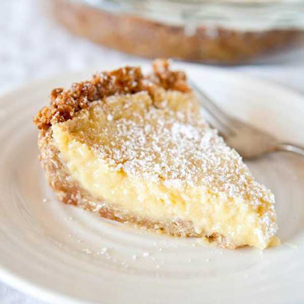 creamy milk bar pie with powdered sugar topping