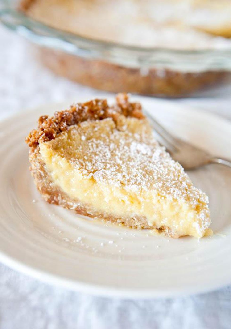 creamy milk bar pie with powdered sugar topping