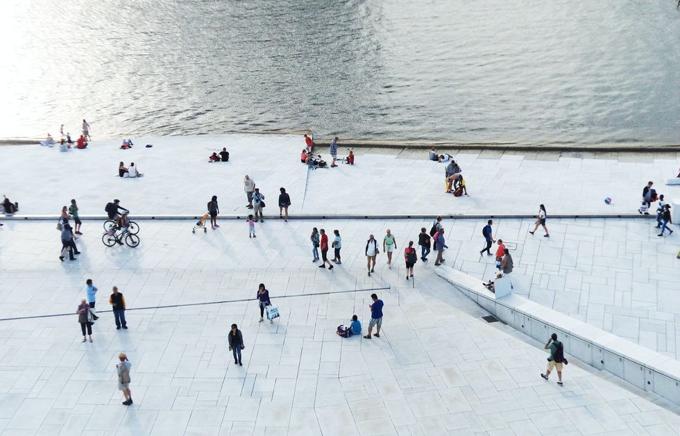 crowds at the foot of the oslo opera house in norway