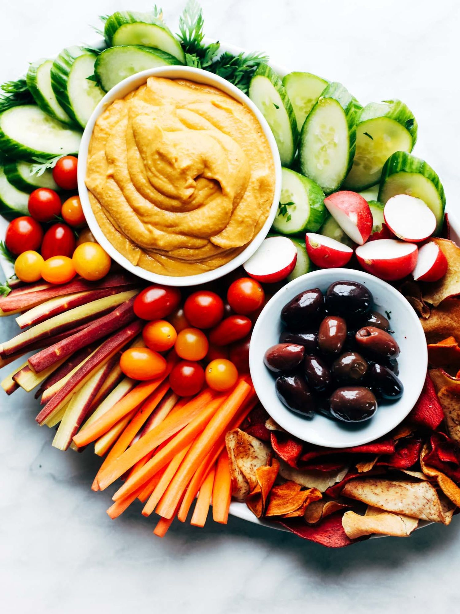 Curry Hummus bowl, with carrots and apple slices, is a great holiday appetizer