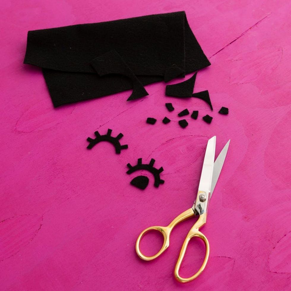 cutting out a black felt eye
