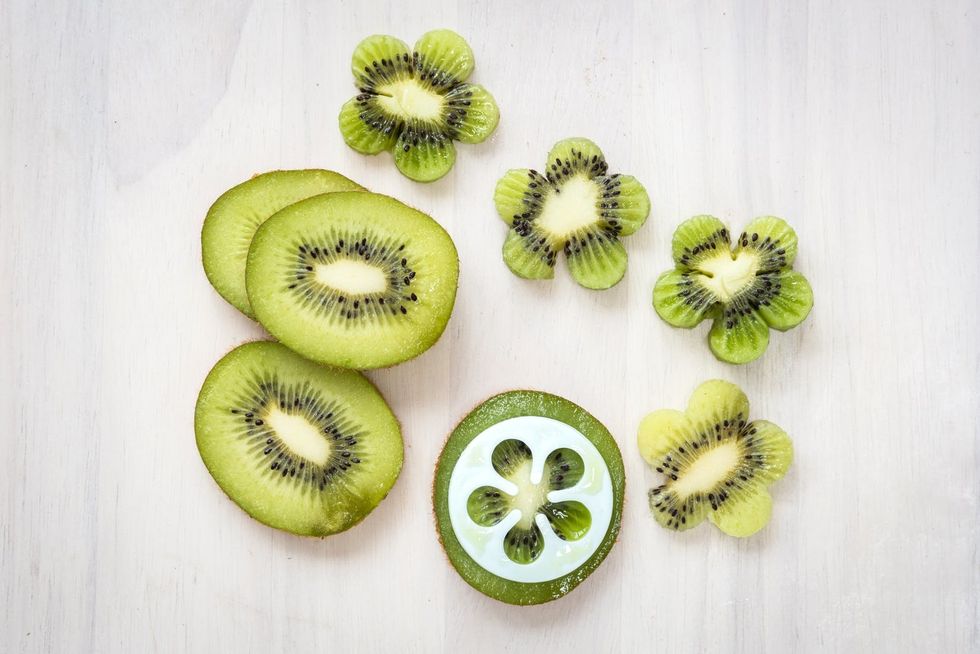 cutting out flower shaped kiwi