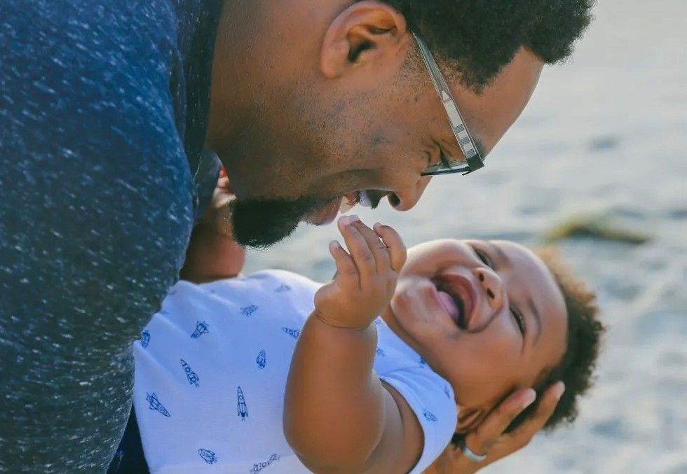 dad holding his baby
