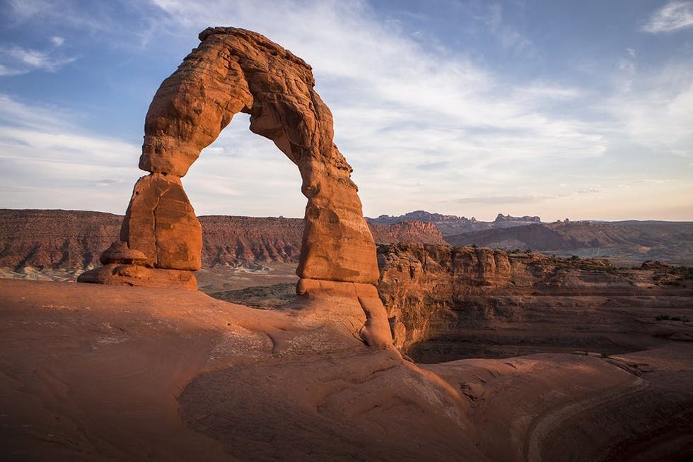 Delicate Arch in Arches National Park is one of the most popular sights in southern Utah, USA. Reaching the Arch takes a brief hike and drive from Moab, Utah, a major adventure and outdoor hub in the American Southwest.