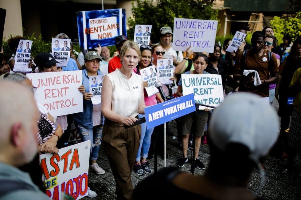 Democratic gubernatorial candidate Cynthia Nixon speaks to attendees during a rally for universal rent control on August 16, 2018 in New York City. Cynthia Nixon, who is running against Gov. Andrew M. Cuomo for the governor seat has pushed for a more response to high rents, also, Nixon has said that cities throughout the state should be allowed to impose it. Only NYC and some nearby areas are allowed to impose rent control, and only on apartments built before 1974.