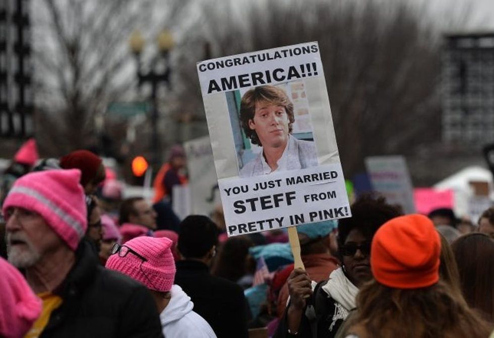 Demonstrators protest on the National Mall in Washington, DC, for the Women's March on January 21, 2017. Hundreds of thousands of protesters spearheaded by women's rights groups demonstrated across the US to send a defiant message to US President Donald Trump. / AFP / Andrew CABALLERO-REYNOLDS (Photo credit should read ANDREW CABALLERO-REYNOLDS/AFP/Getty Images)