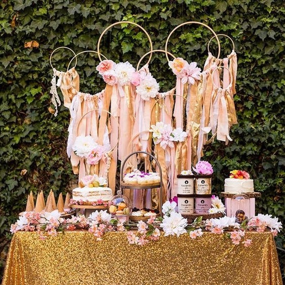 Dessert Bar at a bridal shower with golden table cloth