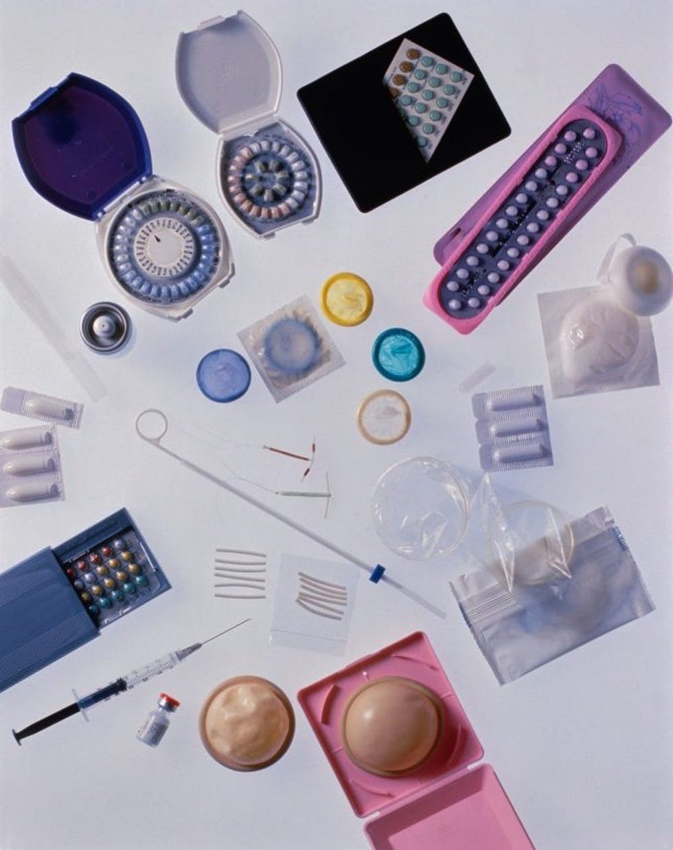 Different kinds of contraceptives, white background