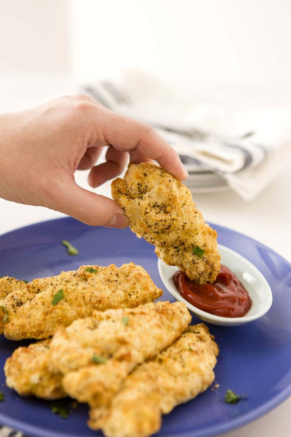 dipping the tenders in ketchup