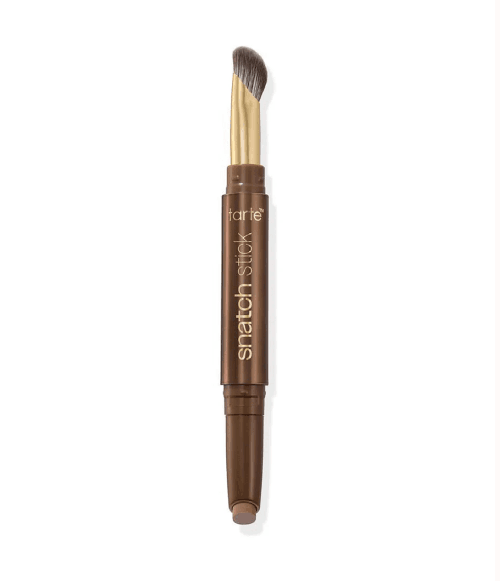 Dual-ended contour stick with a brush on one side and makeup on the other.