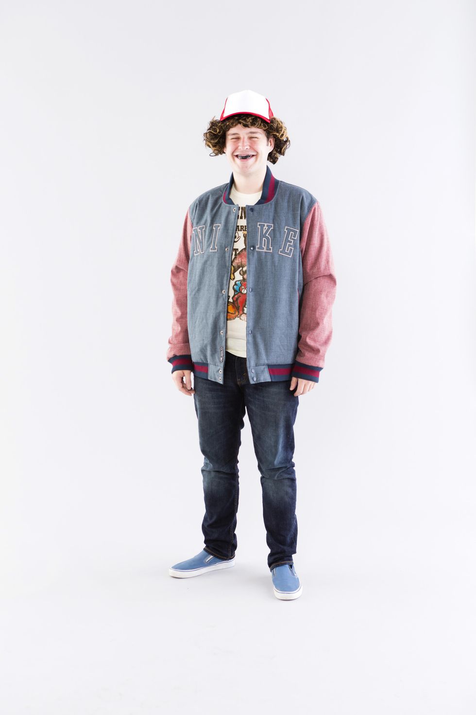 dustin henderson costume with trucker hat and curly wig