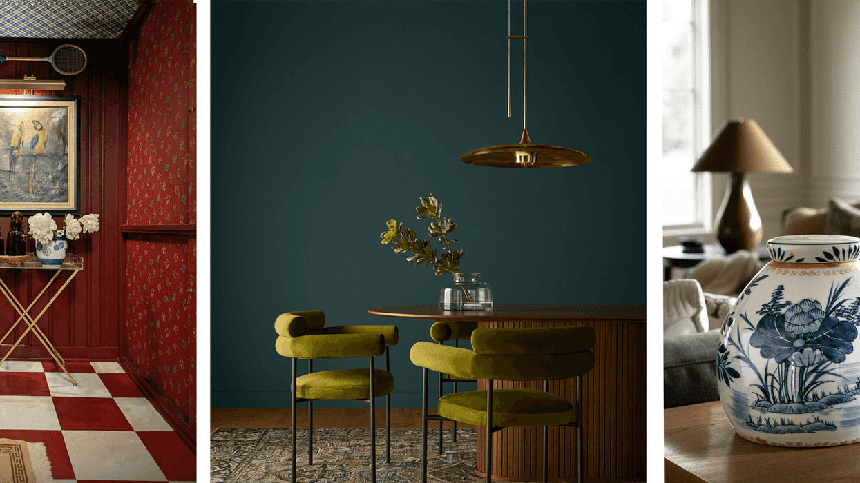 Eclectic interiors with vibrant colors, featuring art, plants, and a blue floral vase.