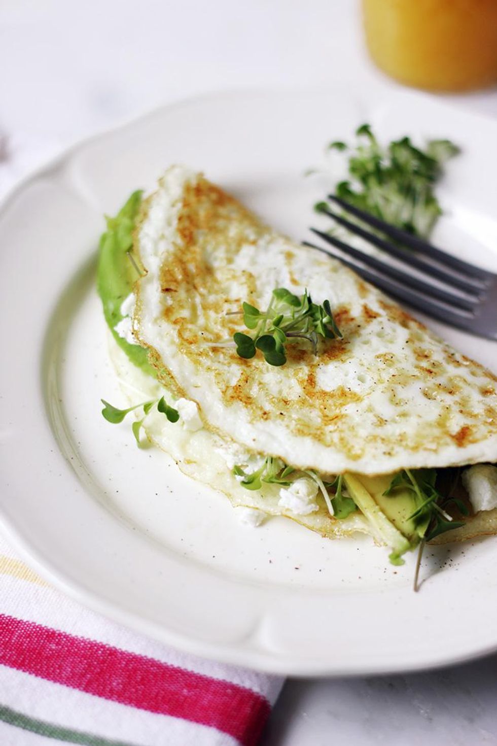 egg white omelet with goat cheese laying beside a fork