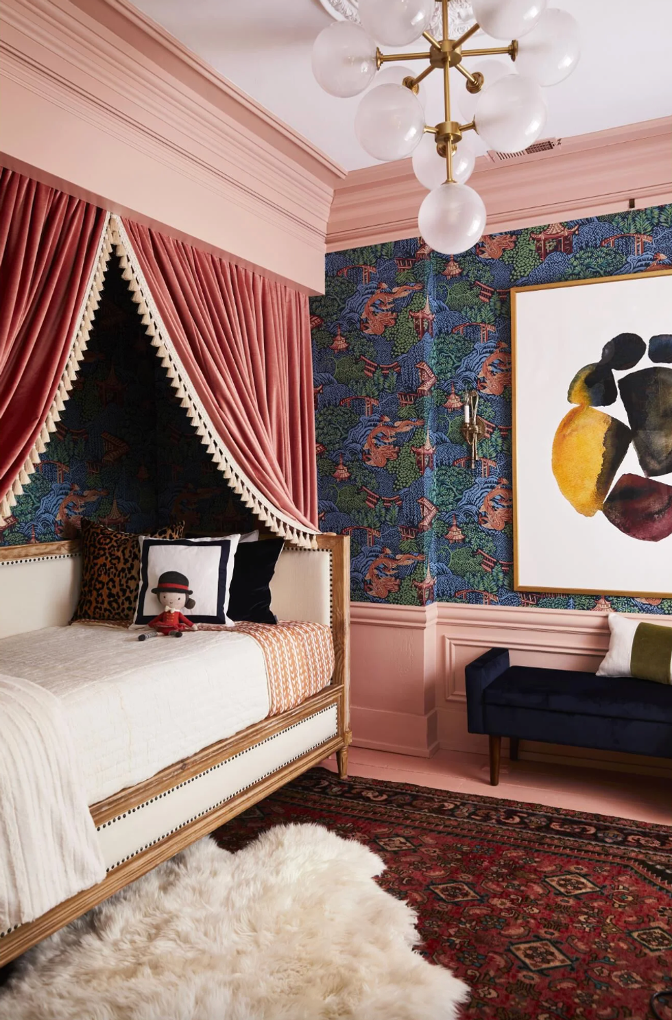 Elegant bedroom with pink curtains, vibrant wallpaper, and a plush wool rug.