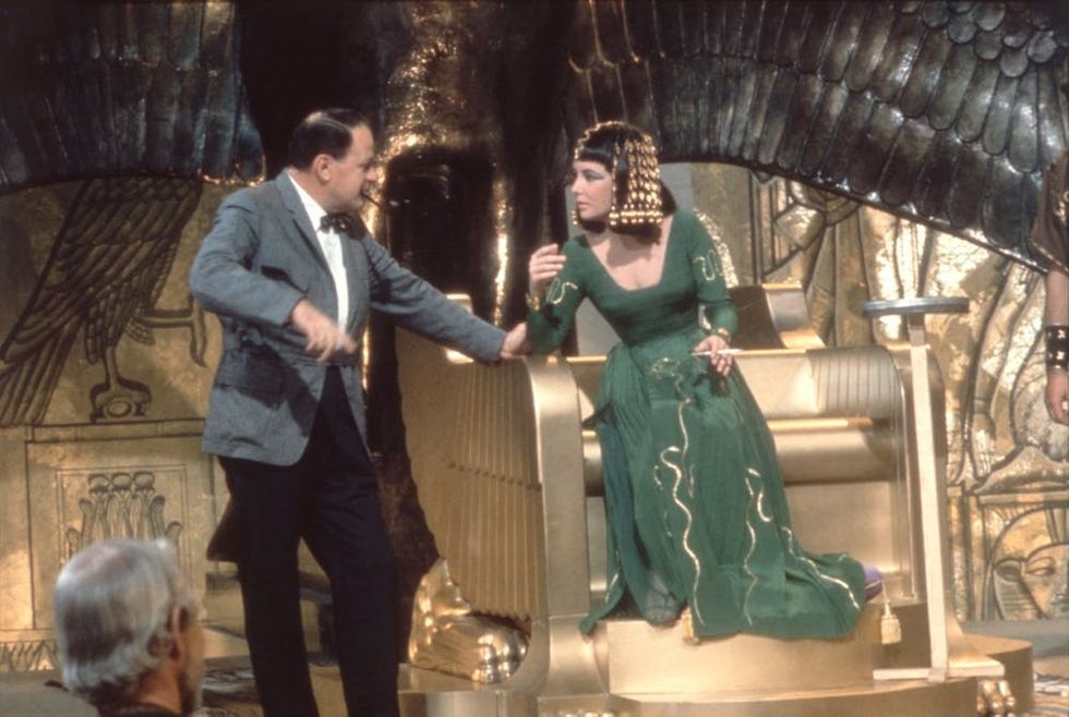 Elizabeth Taylor confers with director Joseph L. Mankiewicz on the set of their film 'Cleopatra'