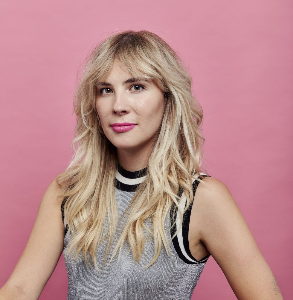 emily henry against a pink background