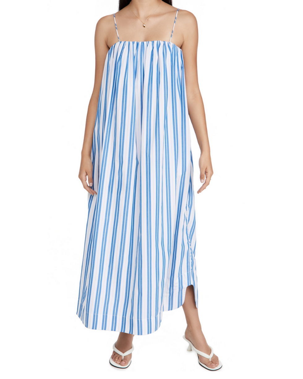 model wears blue and white striped summer maxi dress with white flip flop kitten heels