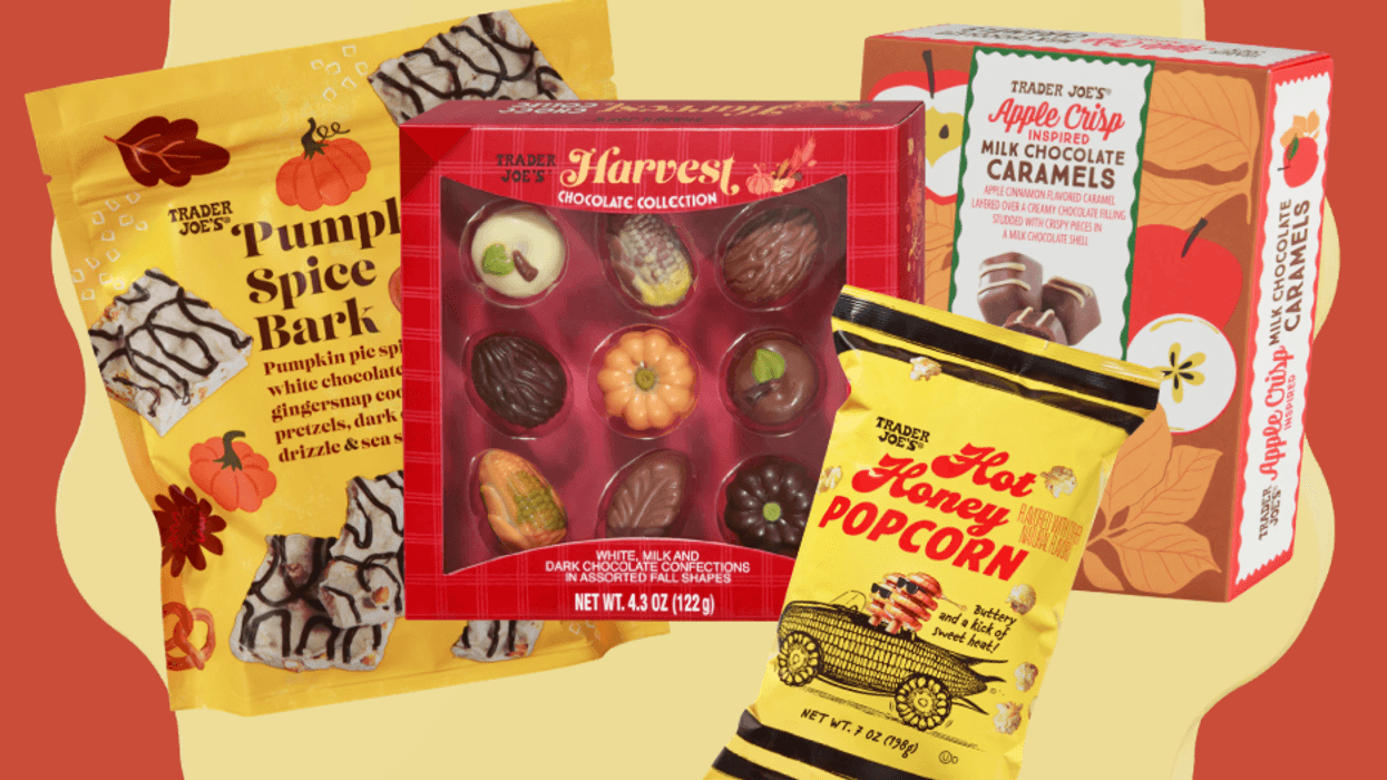 Fall-themed snacks assortment: popcorn, chocolates, bark, and caramels on a red background.