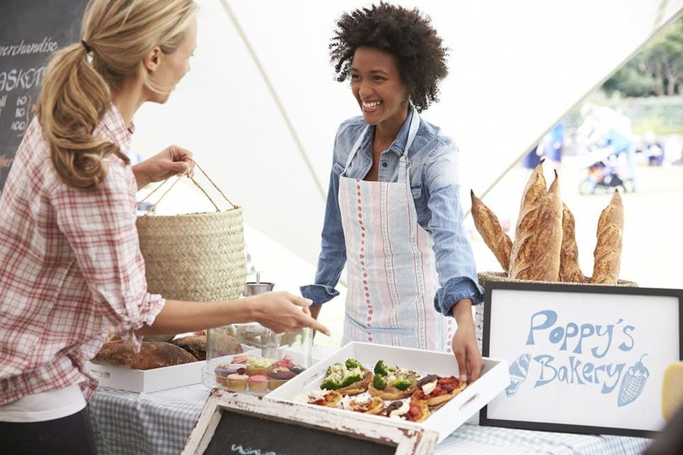 Female Bakery Stall Holder At Farmers Fresh Food Market
