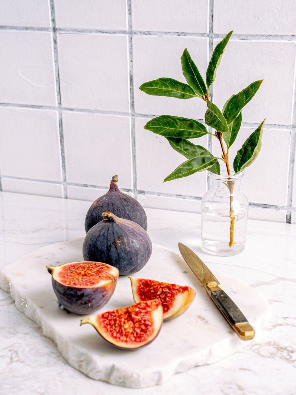 figs sitting on a marble countertop