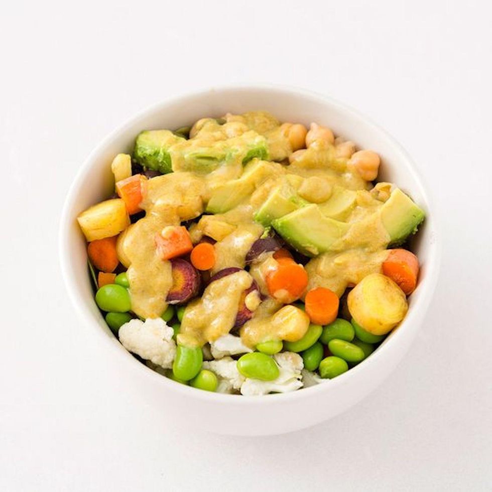 finished buddha bowl with Raw Lemon Tahini Dressing on top