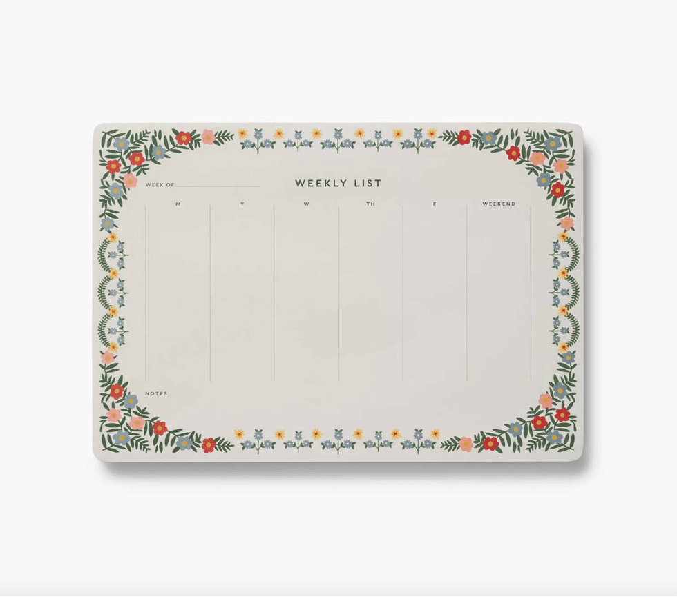 Floral-bordered weekly planner with blank spaces for each day.