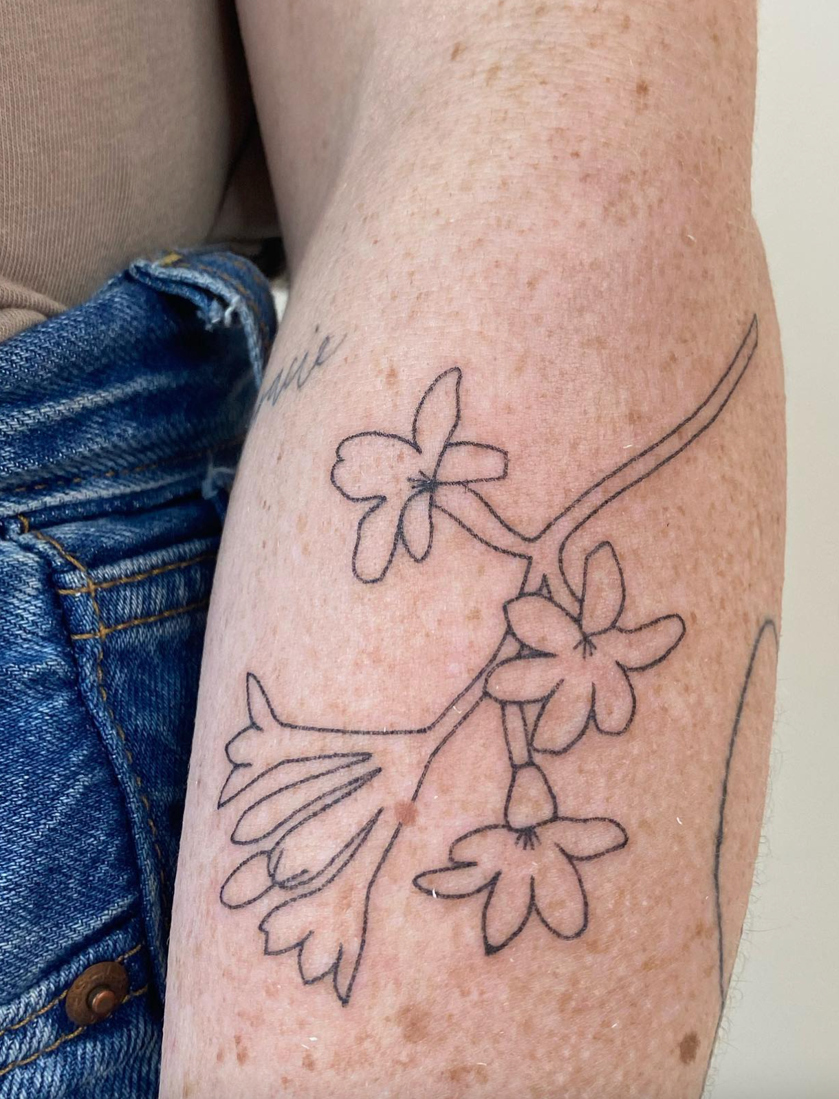 Floral Outline stick and poke tattoo