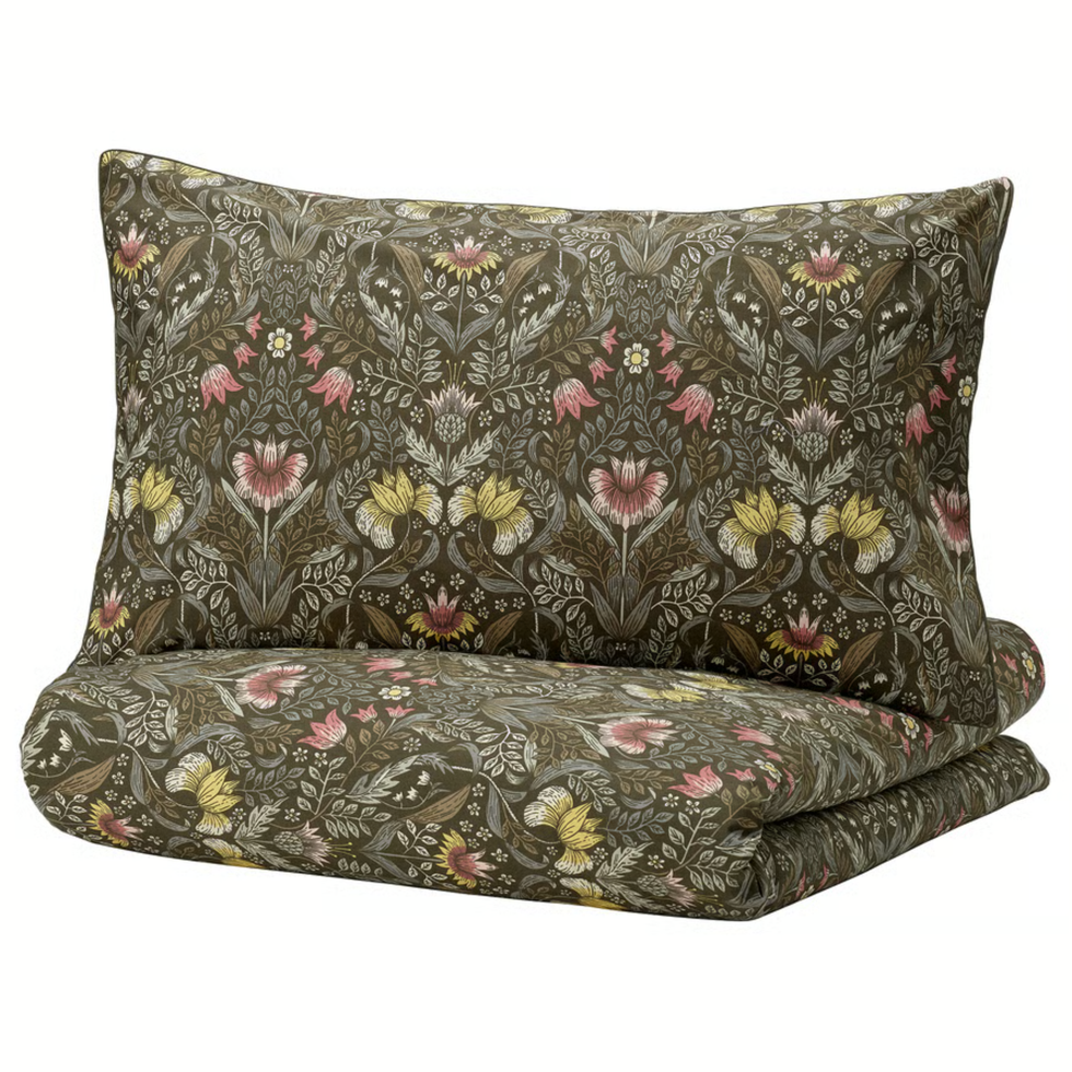 Floral patterned brown pillow and blanket set with pink and yellow accents.