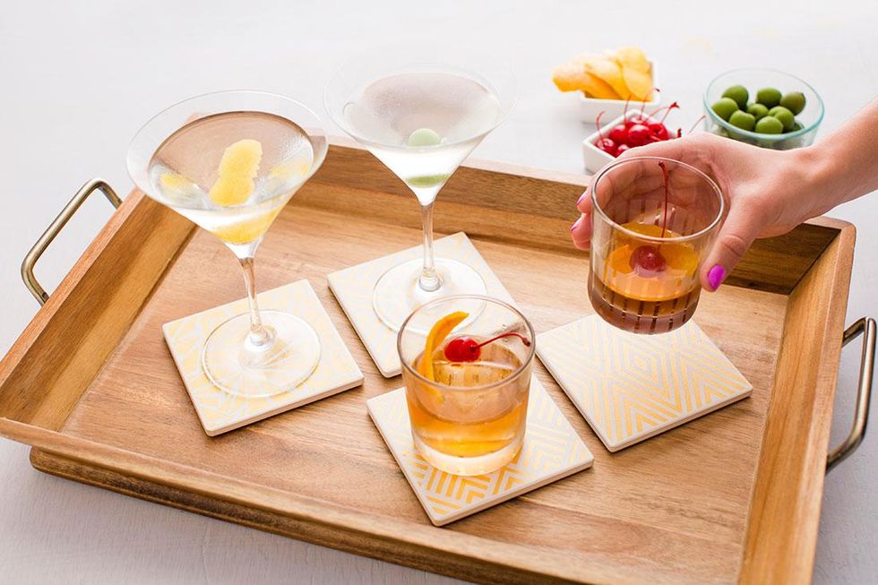Four cocktails on a serving tray are great inspiration for how to make the perfect cocktail.